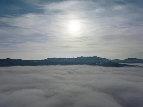 Aerial shot over the clouds while sunrise sky. Foto stock
