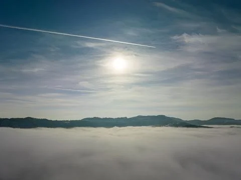 Aerial shot over the clouds while sunrise sky. Foto stock