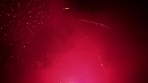 Aerial shot over colorful, exploding fireworks in the air Stock Footage 337057758
