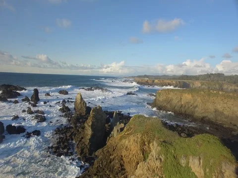 Aerial shot over crashing waves in the Northern California ocean Vídeo Stock 81842853