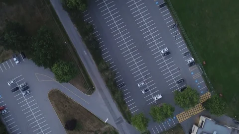 Aerial Shot Over Empty Parking Lot And Sports Field In The Evening Stock Footage 100531240