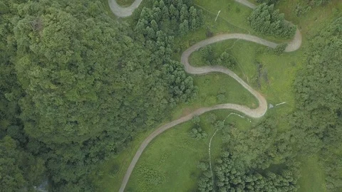 Aerial Shot over Empty Road in the Forest Stock Footage 108363591