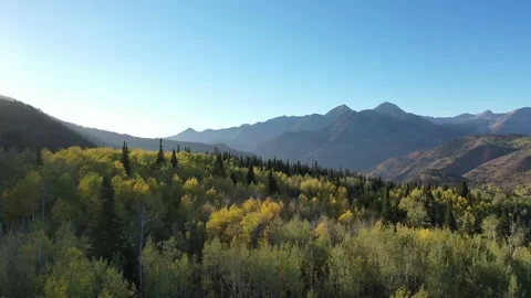 Aerial shot over fall colors at sunset on the backside of Mt Timpanogos in Utah Stock Footage 144137853