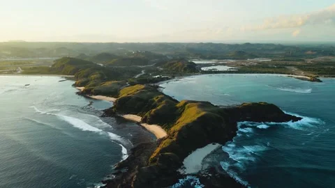 Aerial shot over Lombok Island with famous Bukit Merese Hills and sandy beach Stock Footage