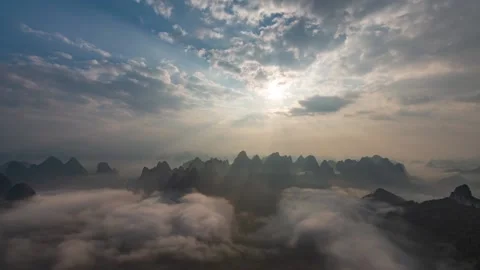 Aerial shot over a mountain with clouds Stockbeeldmateriaal 208090433
