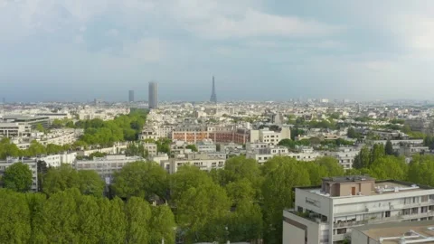 Aerial shot over Paris with the Eiffel Tower and Montparnasse Tower, France Stock Footage 241356136