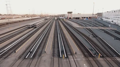 Aerial shot over train tracks by station Stock Footage 89452104