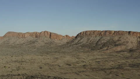Aerial shot over a valley approaching mountains Stock Footage 191058313