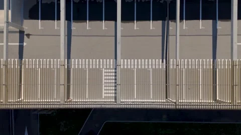 Aerial shot overhead empty spaces at the Saint-Chamand park and ride Stock Footage 266791003