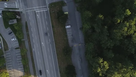 Aerial Shot Overhead Of Tree Lined Road As Traffic And Cars Drive By Stock Footage 100532073