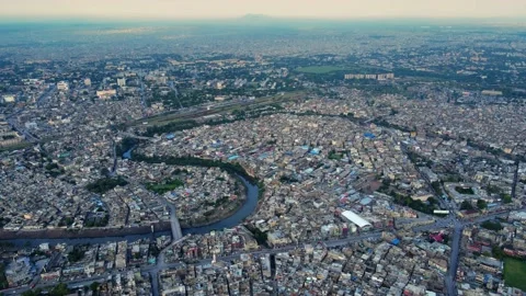 Aerial shot overlooking Lai Nullah and dense population around it in Rawalpindi Stock Footage 236411040