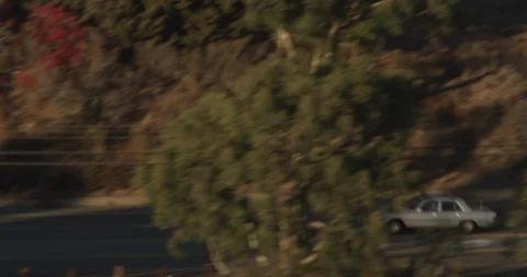 Aerial shot panning quickly down highway, following car Stock Footage 105141835