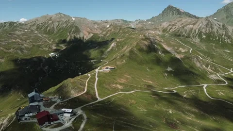 Aerial shot of panoramic view of Swiss Alps with sunny weather Stock Footage