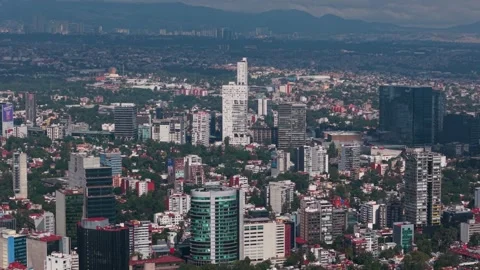 Aerial shot with parallax effect capturing Mexico City's architectural area Stock Footage 319016958