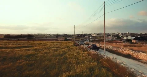 Aerial shot of pickup trucks between farms Stock Footage 75167791