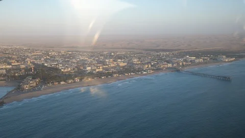 Aerial shot, plane flying over Swakopmund, Namibia, Africa in 4K, plane wing Stock Footage 91142467