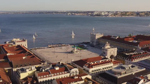 Aerial shot of Plaza do Comércio and Tagus River in Lisbon, Portugal, at sunset. Stock Footage 262065310