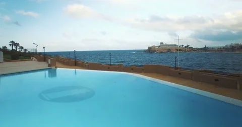 Aerial shot from a pool to the ocean Stock Footage 70927497