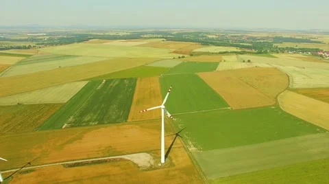 Aerial shot of Power Generating Windmills. Wind turbines producing clean energy. Stock Footage 52079659