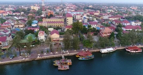 Aerial shot of the Prek Kampong river at sunset in Kampot city Stock Footage 74550341
