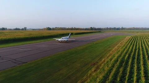 Aerial Shot of Private Jet Taking Off from Regional Airport Stock Footage 100010669