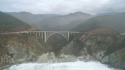 Aerial Shot Pulling Back from Bixby Bridge to Ocean, Big Sur Stock Footage 79171119