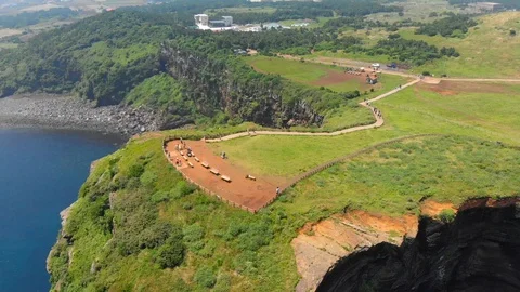 Aerial shot pulling back from lookout point at top of cliff by the ocean Stock Footage 91092328