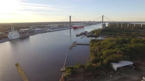 Aerial Shot Pulling Back from the Suspension Bridge between two Cranes Stock Footage 57712905