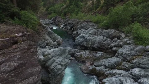 Aerial shot pulls back to reveal blue and white water river Video stock 71182676