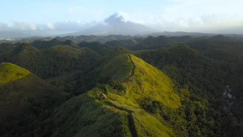 Aerial shot of Quitinday Hills overlooking the Mayon Volcano in the Philippines Stock Footage