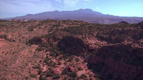 Aerial shot of red cliffs and mountains st george utah Stock Footage 75172904