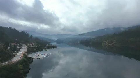 Aerial shot  of the reflection of the sky in a river in a cloudy day Stock Footage 235364749