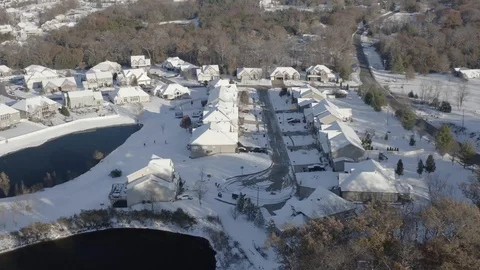 Aerial shot of residential homes covered in snow Stock Footage 111663237