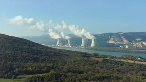 Aerial shot revealing an active nuclear power plant along a river, Cruas, France Stock Footage 292808662