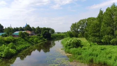 Aerial shot river and church in the ancient town Suzdal, Golden ring, Russia Stock Footage
