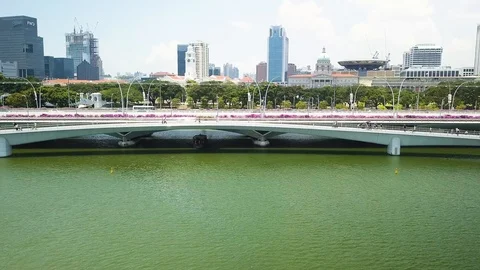 Aerial shot of a river boat crusing down a river, Singapore Stock Footage 96317738