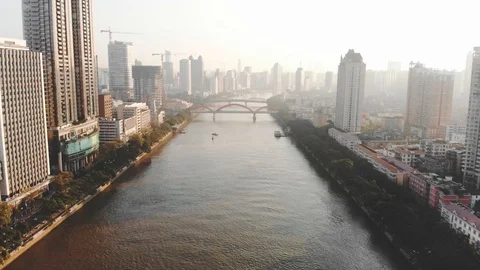 Aerial shot. On the river float boat. In the background is the city and bridges. Stock Footage 101866470