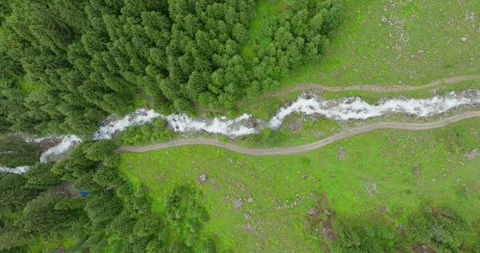 Aerial shot of a river flowing down the mountain Stock Footage 283565400