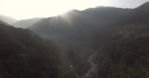 Aerial shot of a river valley surrounded by mountains Stock Footage 142201221