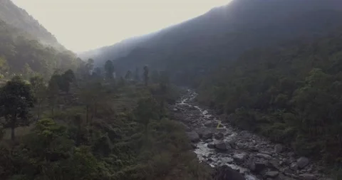 Aerial shot of a river valley surrounded by mountains Stock Footage 142201231