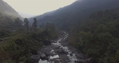 Aerial shot of a river valley surrounded by mountains Stock Footage 142201262