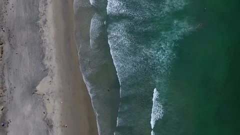 Aerial Shot Of Rolling Ocean Waves and Sandy Beach Stock Footage 146453987