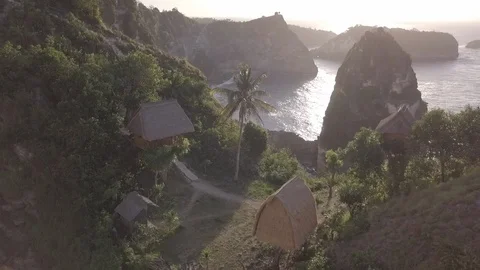 Aerial shot of Rumah Pohon Treehouse Cliff in Nusa Penida Indonesia sunshine 2 Stock Footage