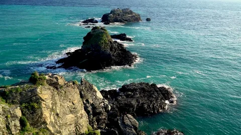 Aerial shot of sea Cliffs. Rocks washed by sea waves. 4K movie drone top view Stock Footage 125592298