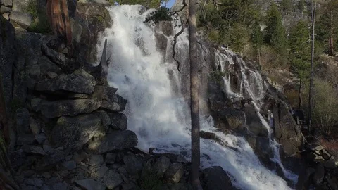 Aerial shot, shadow of Multi-rotor flying up Redwoods and waterfall 002113 Stock Footage 90643459