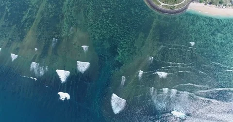 Aerial shot of the shallow reefs of Serangan island Stock Footage