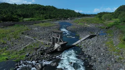 Aerial shot shows a river with a collapsed dam structure. Stock Footage 336852242