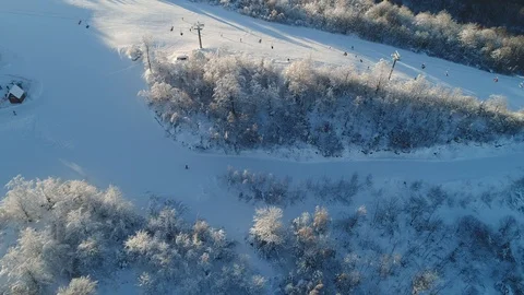 Aerial Shot: Side View Tracking Shot of Good Skier Skiing Down the Ski Slope Stock Footage 102044950