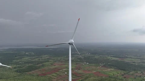 Aerial shot of a single windmill in open fields Stock Footage 302265632
