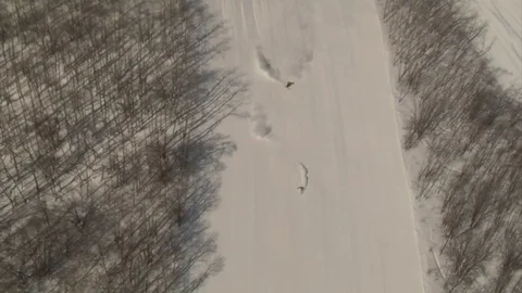 Aerial shot of skier carving Stock Footage